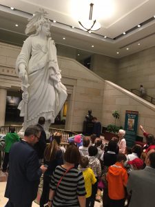Students get a closer look at the plaster model of the Statue of Freedom that sits atop the U.S. Capitol.